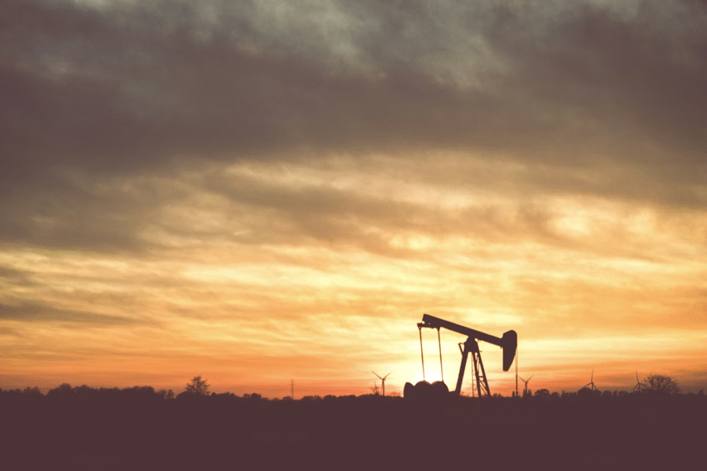 Silhouette of an oil rig during the sunset
